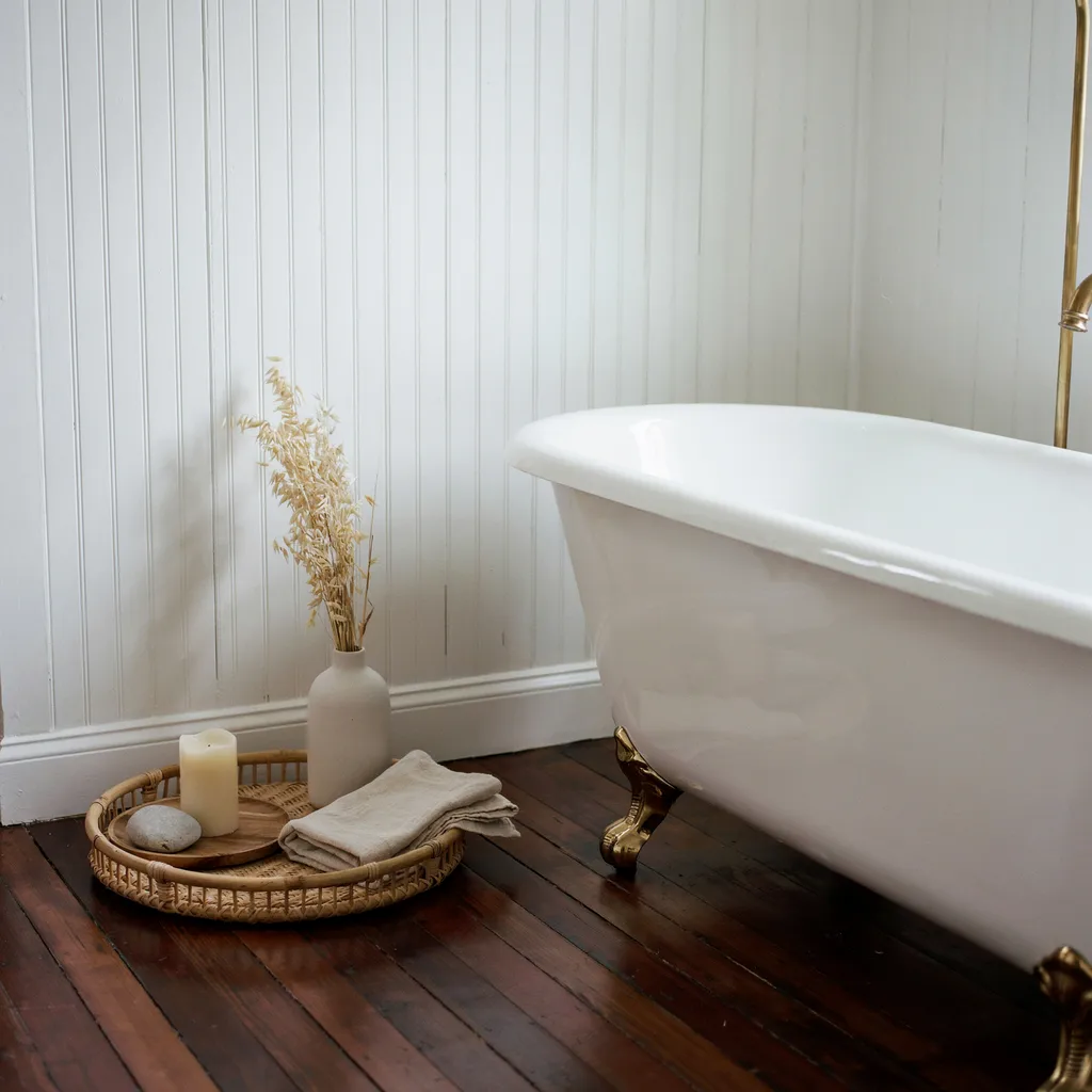 Floor vignette beside a clawfoot bathtub
