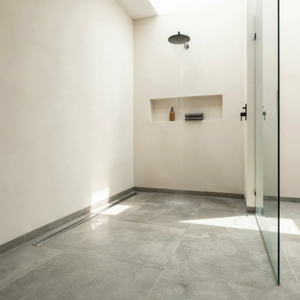 Flush linear drain in a tiled walk-in shower