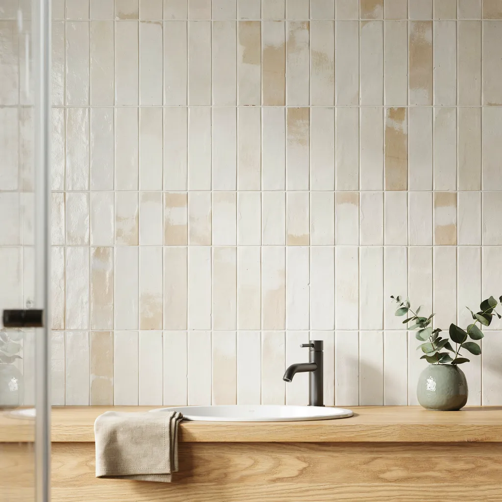 Vertically stacked glossy cream zellige tile backsplash for modern bathroom design ideas