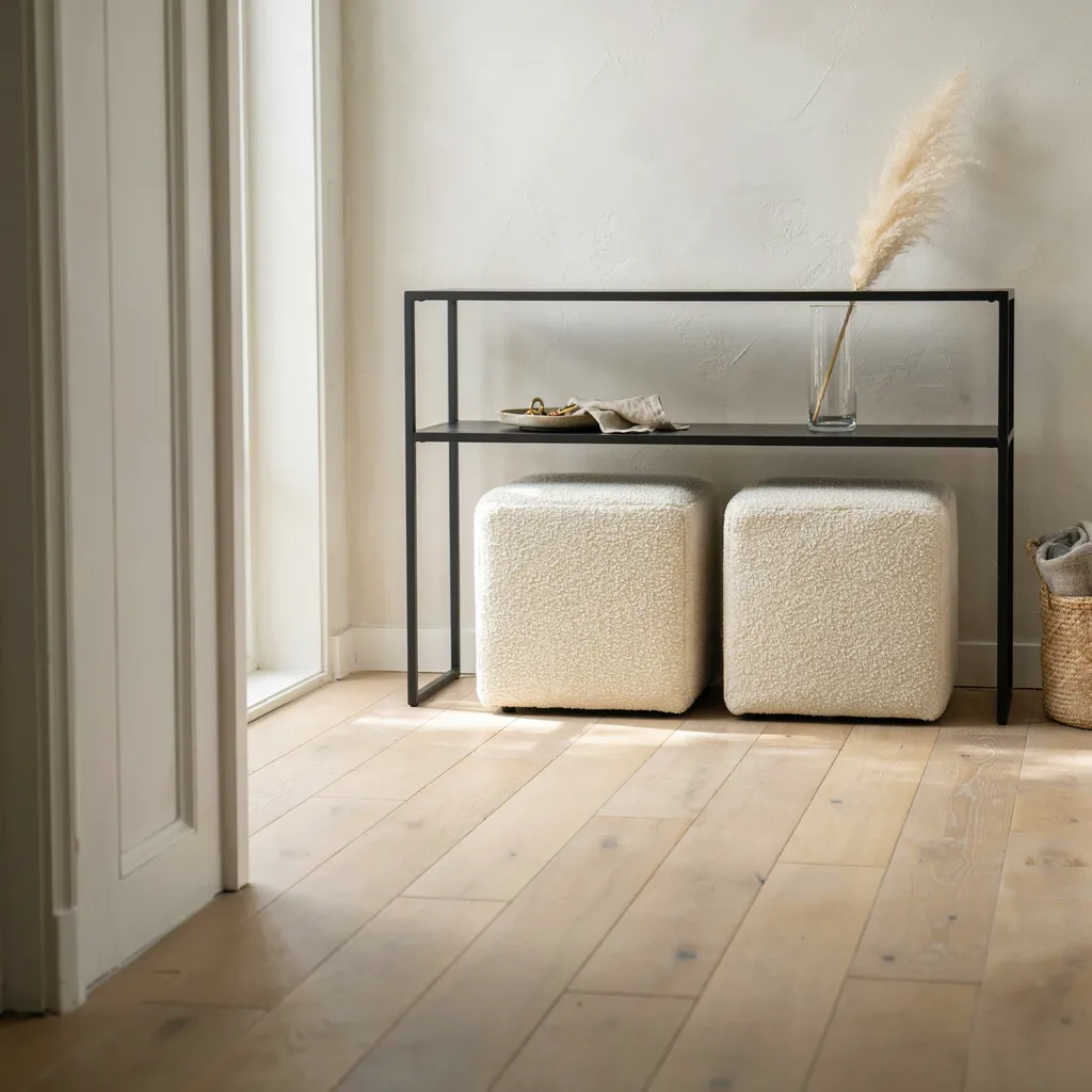 Twin bouclé ottomans under console table