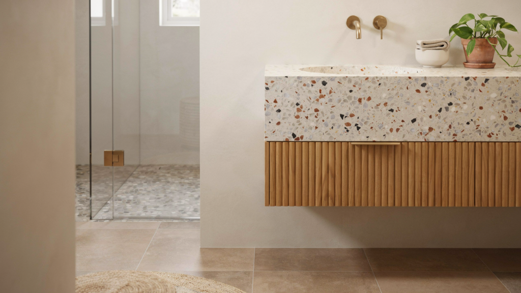 Modern washroom with terrazzo vanity and fluted oak cabinet